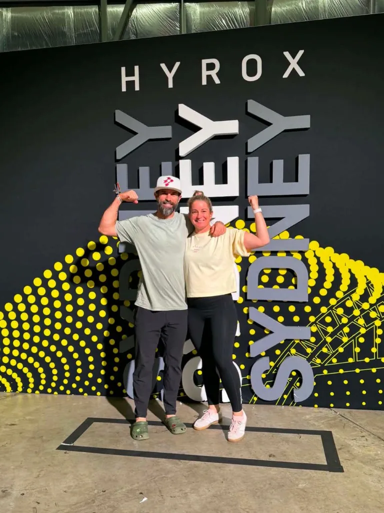 CrossFit Ulladulla members flexing at the HYROX Sydney wall