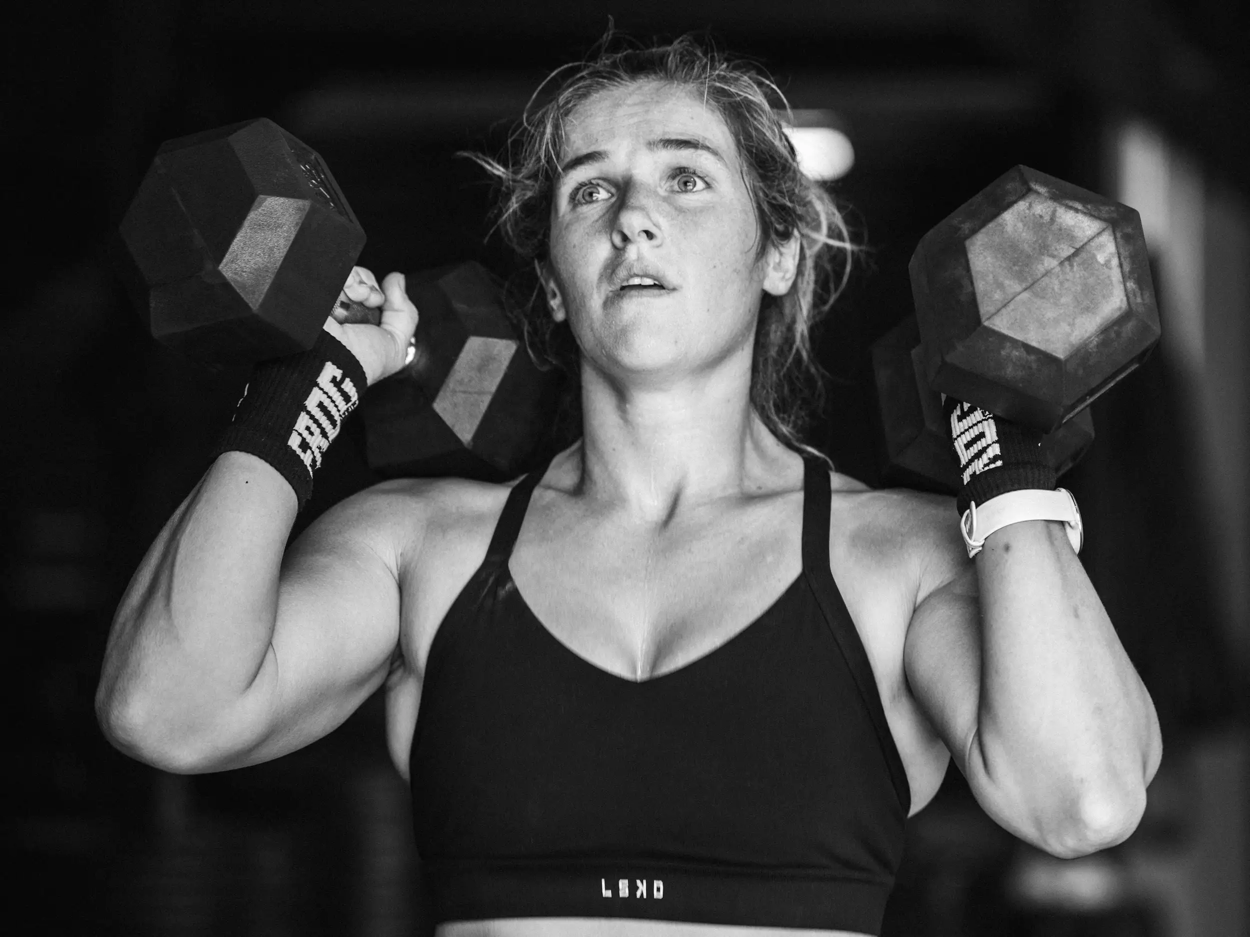 Athletes performing dumbbell work during a BodyTone class
