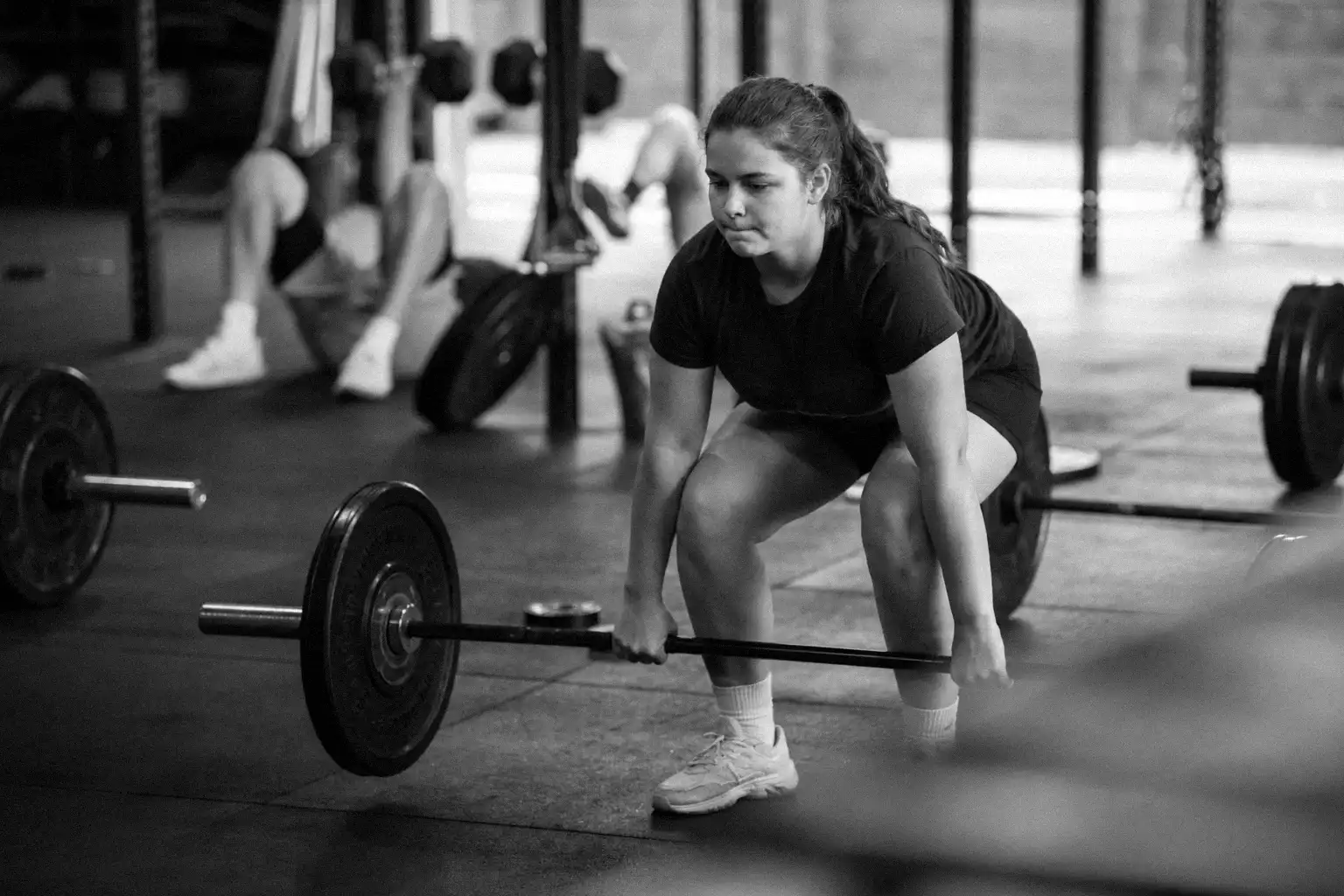 A coach leading a structured class for young athletes